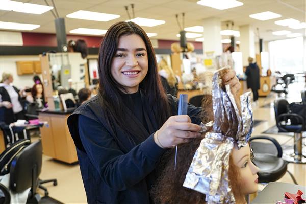 Cosmetology students working on Mannequins 